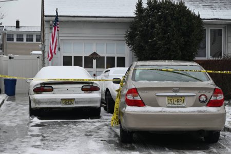 Photo for Police tape surrounds a home Thursday morning where two children and two adults were found dead in Union, New Jersey. January 18, 2024, Union, New Jersey, USA: The Union County Prosecutor's Office Homicide Task Force - Royalty Free Image