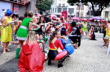 Photo for Rio de Janeiro (RJ), Brazil 01/27/2024 - Traditional carioca festivities block known for its costumes of heroes, guitars and classic characters, parades in the Central region of Rio de Janeiro . - Royalty Free Image
