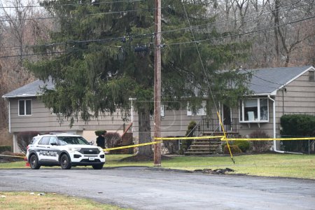 Photo for Police are searching for a shooter after a woman was shot and killed in Ramapo, New York. January 31, 2024, Ramapo, New York, USA: Authorities responded to the scene on Inwood Drive at approximately 9:00 a.m. - Royalty Free Image