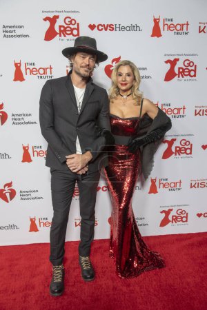 Photo for The American Heart Association's Red Dress Collection Concert 2024. January 31, 2024, New York, New York, USA: (L-R) Christopher Backus and Mira Sorvino attend The American Heart Association's Red Dress Collection Concert 2024 at Jazz - Royalty Free Image