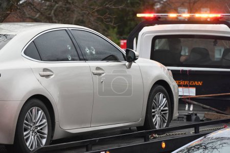 Photo for Vehicle where deceased victim found, towed away. Two people shot, one person dead in a shooting in Temple Hills, Maryland. February 10, 2024, Temple Hills, Maryland, USA - Royalty Free Image