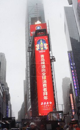 Photo for Happy Chinese New Year. February 13, 2024, New York, USA: Bill board at Times Square shows and wishes New Yorkers and tourists "Happy Chinese New Year," the year of the dragon amid snowstorm that struck this city on Tuesday 13. - Royalty Free Image