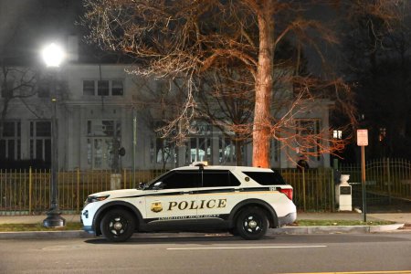 Photo for FBI and United States Secret Service officers raid the Venezuelan Ambassador's Residence in Washington, DC. February 15, 2024, Washington, DC, USA: Heavy police activity could be seen in the area and FBI agents had raid jackets - Royalty Free Image