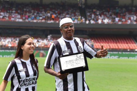 Photo for Sao Paulo (SP), 02/25/2024 - Former Santos player Serginho Chulapa receives a tribute from the President of Santos Marcelo Texeira in celebration of the 40th anniversary of his goal against Corinthian - Royalty Free Image