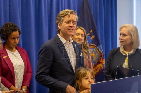 Photo for Senator Gillibrand Calls For The Passage Of The Access To Family Building Act Legislation. March 3, 2024, New York, New York, USA: New York State Senator Brad Hoylman-Sigal standing with daughter Lucy Hoylman-Sigal - Royalty Free Image