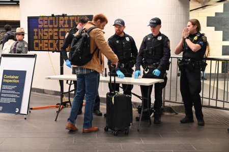 Photo for March 7, 2024, Manhattan, New York, USA - National Guard, MTA Police, New York State Police search luggage of subway riders at 34th StreetPenn Station in Manhattan, New York. - Royalty Free Image