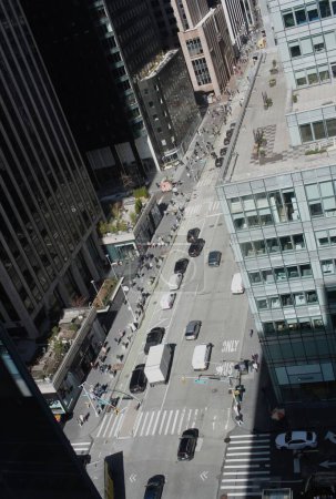 Photo for March 8, 2024, New York, USA: The Aerial View of Manhattan-Bryant Park Area from Bank of America Building, New York showing pedestrians and vehicles movements. - Royalty Free Image