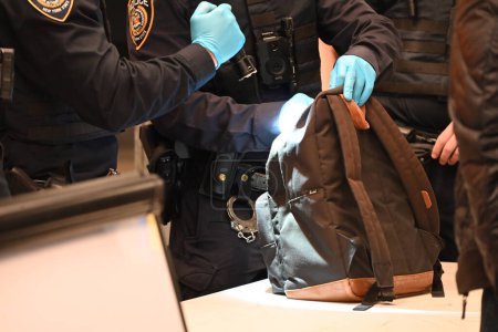 Photo for March 7, 2024, Manhattan, New York, USA - National Guard, MTA Police, New York State Police search luggage of subway riders at 34th StreetPenn Station in Manhattan, New York. - Royalty Free Image