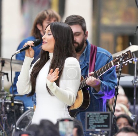 Photo for Kacey Musgrave at Today Show.  March 15, 2024 , New York , USA: Kacey Musgraves, the Grammy-winning country singer-songwriter, debuted her poignant new song "Architect" on the iconic Rockefeller Plaza stage - Royalty Free Image
