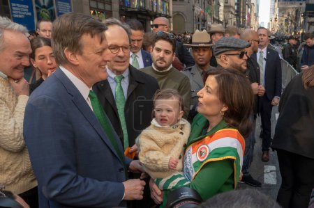 Photo for St. Patrick's Day Parade in New York City.  March 16, 2024, New York, New York, USA: (L-R) Mike Carroll, Seamus Carroll (16 Months old) and New York State Governor Kathy Hochul - Royalty Free Image