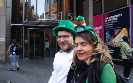 Photo for Saint Patrick's Day  Celebrated in New York City. March 16, 2024, New York, USA: New Yorkers and tourists mostly dressed up in green outfits are seen celebrating Saint Patrick's Day in restaurants, at Times Square and around Manhattan - Royalty Free Image