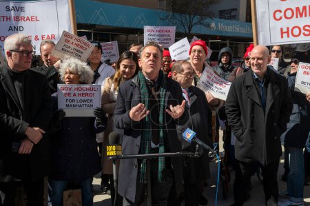 Photo for Elected Officials Representing Lower Manhattan Rally As Mount Sinai Beth Israel Planned Closure Nears. March 24, 2024, New York, New York, USA: New York State Assemblymember Tony Simone speaks at a rally calling to keep Mount Sinai Beth Israel - Royalty Free Image
