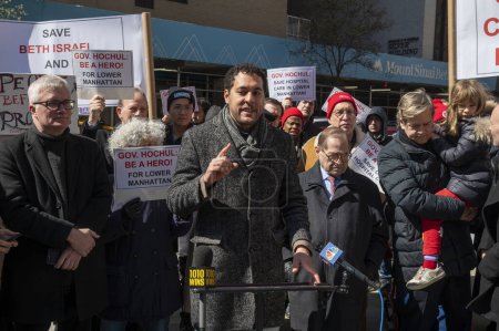 Photo for Elected Officials Representing Lower Manhattan Rally As Mount Sinai Beth Israel Planned Closure Nears. March 24, 2024, New York, New York, USA: New York City Councilmember Christopher Marte speaks at a rally calling to keep Mount Sinai Beth - Royalty Free Image