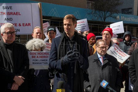Photo for Elected Officials Representing Lower Manhattan Rally As Mount Sinai Beth Israel Planned Closure Nears. March 24, 2024, New York, New York, USA: New York City Councilmember Erik Bottcher speaks at a rally calling to keep Mount Sinai Beth Israel - Royalty Free Image