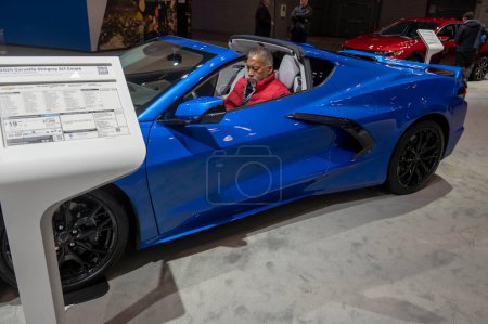 Photo for The New York International Auto Show 2024. March 27, 2024, New York, New York, USA: A man seats in a 2024 Chevrolet Corvette Stingray 3LT Coupe during the International Auto Show press preview at the Jacob Javits Convention Center - Royalty Free Image