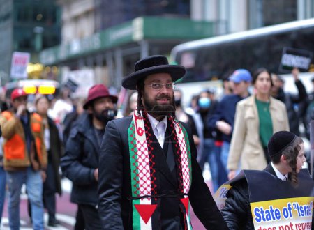 Photo for Pro Palestine Massive Protest. March 30, 2024, New York , USA:  Thousands of demonstrators flooded 42nd Street and Broadway today, marching towards 5th Ave in a massive pro-Palestine protest. - Royalty Free Image