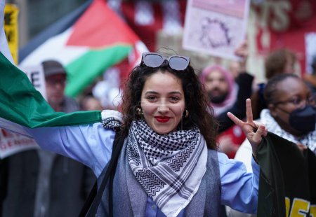 Photo for Pro Palestine Massive Protest. March 30, 2024, New York , USA:  Thousands of demonstrators flooded 42nd Street and Broadway today, marching towards 5th Ave in a massive pro-Palestine protest. - Royalty Free Image