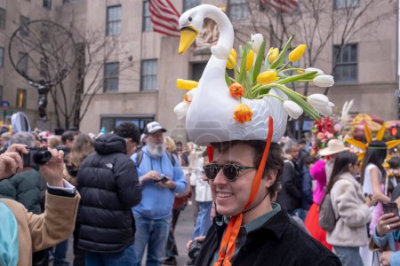 Photo for Easter Bonnet Parade. March 31, 2024, New York, New York, USA: A man in a lavishly decorated hat attends the Easter Parade and Bonnet Festival 2024 outside St. Patrick's Cathedral - Royalty Free Image