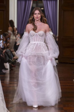 Photo for Idan Cohen Bridal Spring 2025 Runway Show. April 02, 2024, New York, New York, USA: A model walks the runway at the Idan Cohen Bridal Spring 2025 Runway Show at The St. Regis Hotel on April 02, 2024 in New York City. - Royalty Free Image