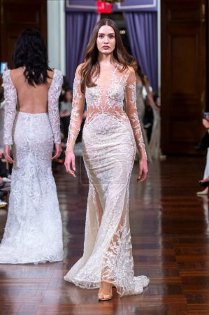 Photo for Idan Cohen Bridal Spring 2025 Runway Show. April 02, 2024, New York, New York, USA: A model walks the runway at the Idan Cohen Bridal Spring 2025 Runway Show at The St. Regis Hotel on April 02, 2024 in New York City. - Royalty Free Image