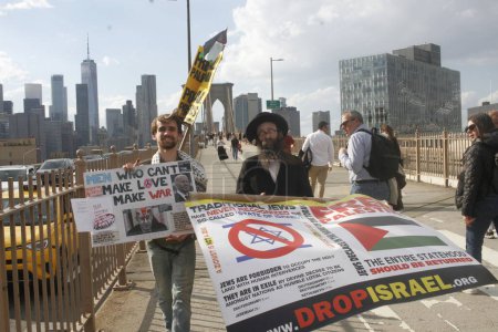 Photo for Pro Palestine Protest On Brooklyn Bridge. April 15, 2024, New York, USA: NYPD was able to disperse Pro Palestine Protesters who were protesting and attempted blocking traffic on Brooklyn Bridge demanding ceasefire and end to the Israel - Royalty Free Image