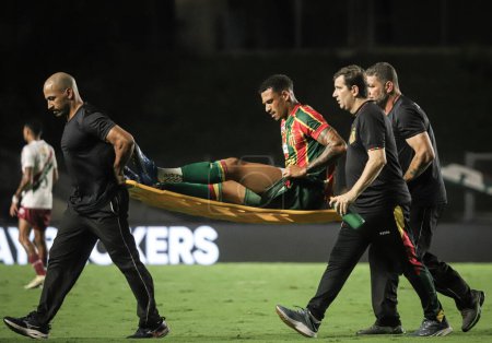 Photo for CARIACICA (ES), 01/05/2027 The Sampaio Correa player is injured, during a match between Sampaio Correa (MA) x Fluminense (RJ), valid for the third phase of the Copa do Brasil, held at the Kleber Andrade stadium - Royalty Free Image