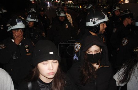 Photo for NYPD entered the Columbia University Campus and Clamped Down on Anti-Israel Protesters inside and also outside the college. April 30, 2024, New York, USA: NYPD got inside the Columbia University campus to dismantle the encampment - Royalty Free Image