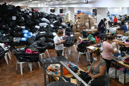 Photo for SAO PAULO (SP), 05/10/2024 - DONATION/TRAGEDY/FLOOD/RIO GRANDE DO SUL-Sao Paulo Futebol Clube employees and volunteers work to organize the donations received to help the victims of the climate tragedy in Rio Grande do Sul - Royalty Free Image