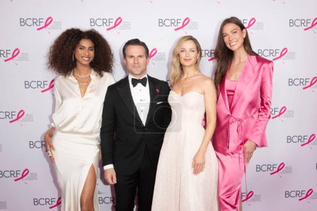 Photo for Breast Cancer Research Foundation Hot Pink Party. May 14, 2024, New York, New York, USA: (L-R) Imaan Hammam, Justin Boxford, Carolyn Murphy and Karlie Kloss attend the Breast Cancer Research Foundation Hot Pink Party at The Glasshouse - Royalty Free Image