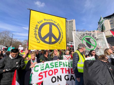 Photo for London, England, UK - March 9 2024: CNC Campaign nuclear Disarmament of peaceful anti- war coalition protest demonstration crowds for ceasefire in Gaza Middle East march from Hyde Park to US embassy - Royalty Free Image