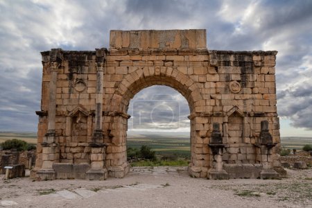 Iconic Triumphal Arch of Volubilis, an old ancient Roman city in Morocco, North Africa