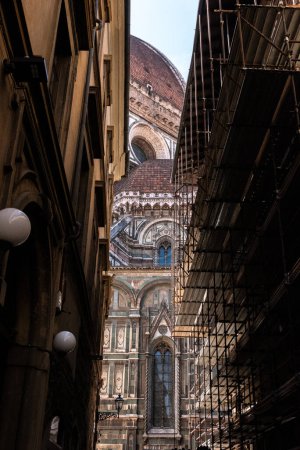 Cupola of the cathedral Santa Maria del Fiore in Florence from a street nearby, Italy