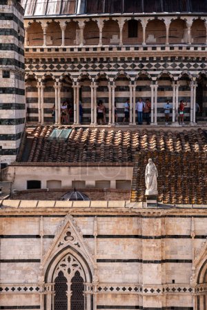 Photo for SIENA, ITALY - SEPTEMBER 23, 2023 - Tourists on the roof of the Siena cathedral, seen from the Facciatone panoramic viewpoint, Italy - Royalty Free Image
