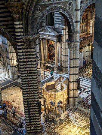 Photo for SIENA, ITALY - SEPTEMBER 23, 2023 - Rich ornate marble pulpit in the Siena cathedral in Italy, designed by Niccolo Pisano - Royalty Free Image