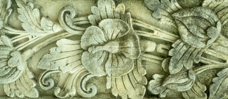Foto de Close up architectural carved concrete intricate flower design with mildew stains and dirt - Imagen libre de derechos
