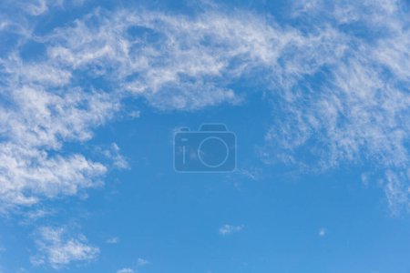 Photo for Scattered clouds during the daytime with a blue sky - Royalty Free Image