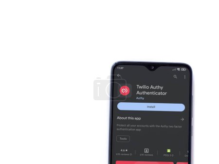 Foto de Lod, Israel - July 16,2023: Twilio Authy Authenticator app play store page on smartphone on white background. Top view flat lay with copy space. - Imagen libre de derechos