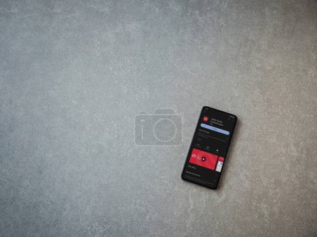 Foto de Lod, Israel - July 16,2023: Twilio Authy Authenticator app play store page on smartphone on ceramic stone background. Top view flat lay with copy space. - Imagen libre de derechos