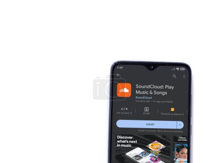 Foto de Lod, Israel - July 16,2023: SoundCloud app play store page on smartphone on white background. Top view flat lay with copy space. - Imagen libre de derechos