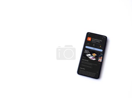 Foto de Lod, Israel - July 16,2023: SoundCloud app play store page on smartphone on white background. Top view flat lay with copy space. - Imagen libre de derechos