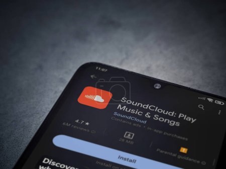 Foto de Lod, Israel - July 16,2023: SoundCloud app play store page on smartphone on a dark marble stone background. Top view flat lay with copy space. - Imagen libre de derechos