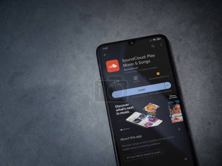Foto de Lod, Israel - July 16,2023: SoundCloud app play store page on smartphone on a dark marble stone background. Top view flat lay with copy space. - Imagen libre de derechos