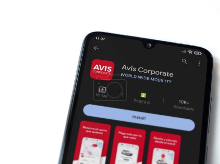Photo for Lod, Israel - July 16,2023: Avis Corporate app play store page on smartphone on white background. Top view flat lay with copy space. - Royalty Free Image