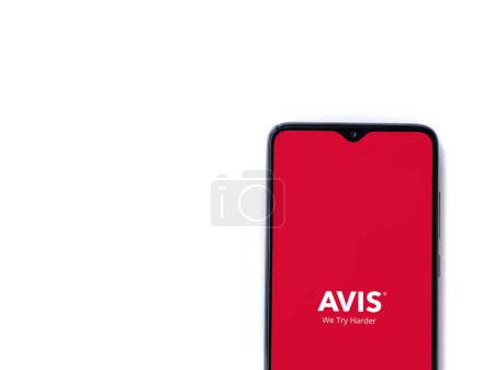 Photo for Lod, Israel - July 16,2023: Avis IL app launch screen on smartphone on white background. Top view flat lay with copy space. - Royalty Free Image