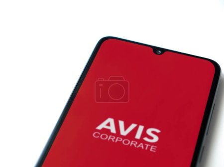 Photo for Lod, Israel - July 16,2023: Avis Corporate app launch screen on smartphone on white background. Top view flat lay with copy space. - Royalty Free Image