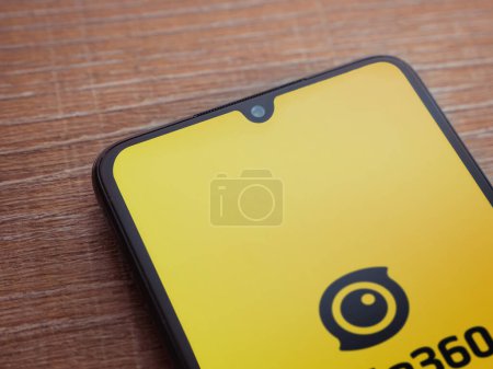Photo for Lod, Israel - July 16,2023: Insta360 app launch screen on smartphone on wooden background.. Top view flat lay with copy space. - Royalty Free Image