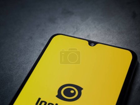 Photo for Lod, Israel - July 16,2023: Insta360 app launch screen on smartphone on dark marble stone background. Top view flat lay with copy space. - Royalty Free Image
