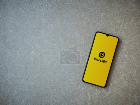 Photo for Lod, Israel - July 16,2023: Insta360 app launch screen on smartphone on ceramic stone background.. Top view flat lay with copy space. - Royalty Free Image