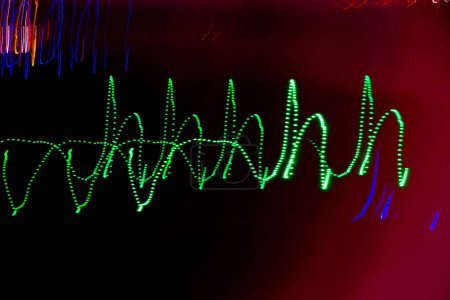 Abstract blurry background with pattern from colorful traces or trajectory of lights.Abstract colourful light pattern long exposure. High quality photo