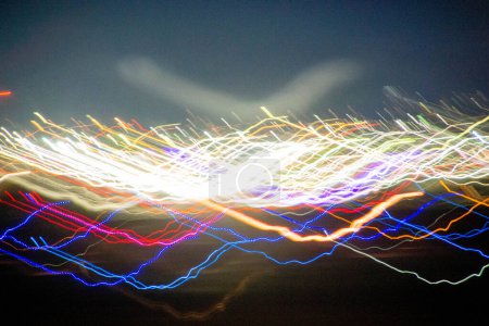 Abstract blurry background with pattern from colorful traces or trajectory of lights.Abstract colourful light pattern long exposure. High quality photo
